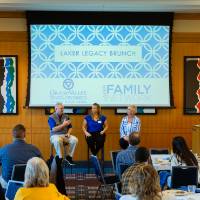 Three alumni speaking on a panel
